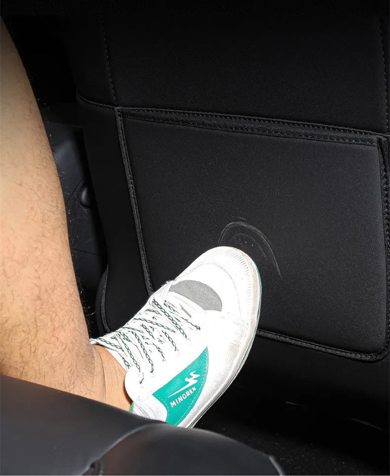 Black leather car seat anti kick pad with pocket measuring 68cm by 42cm