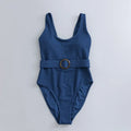Navy blue women's one-piece swimsuit with slimming triangle design and chest pads
