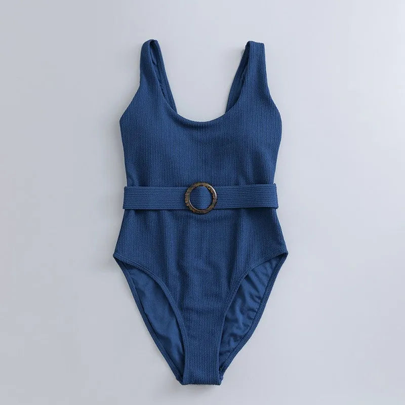 Navy blue women's one-piece swimsuit with slimming triangle design and chest pads