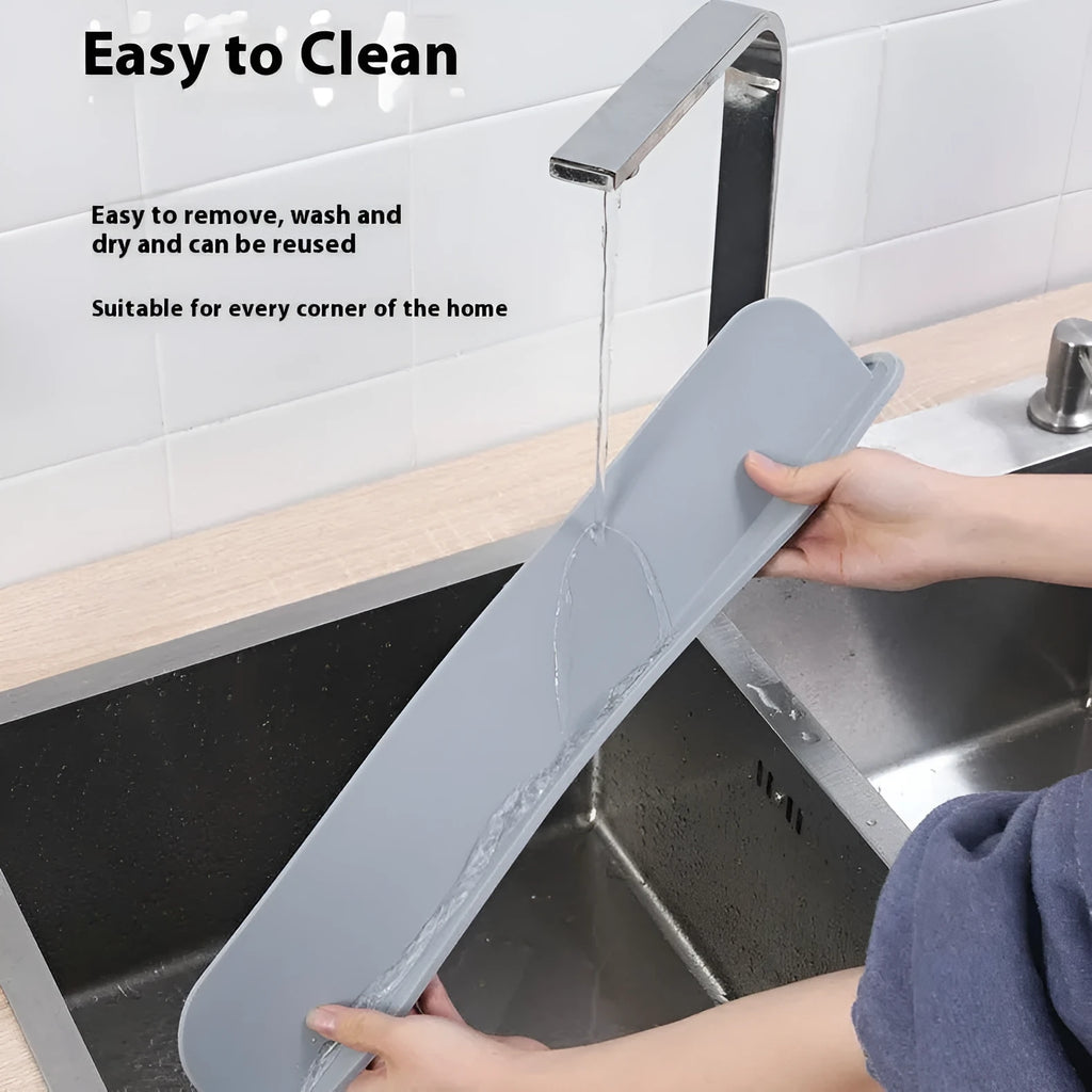 A thick grey silicone water blocking plate for a kitchen sink, shown next to a sink edge.