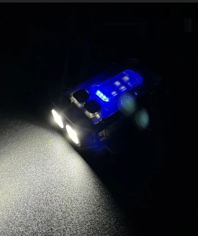 Portable tactical mini warning flashlight with a black housing, showing the LED lens, a side mounting clip, and an included USB charging cable.