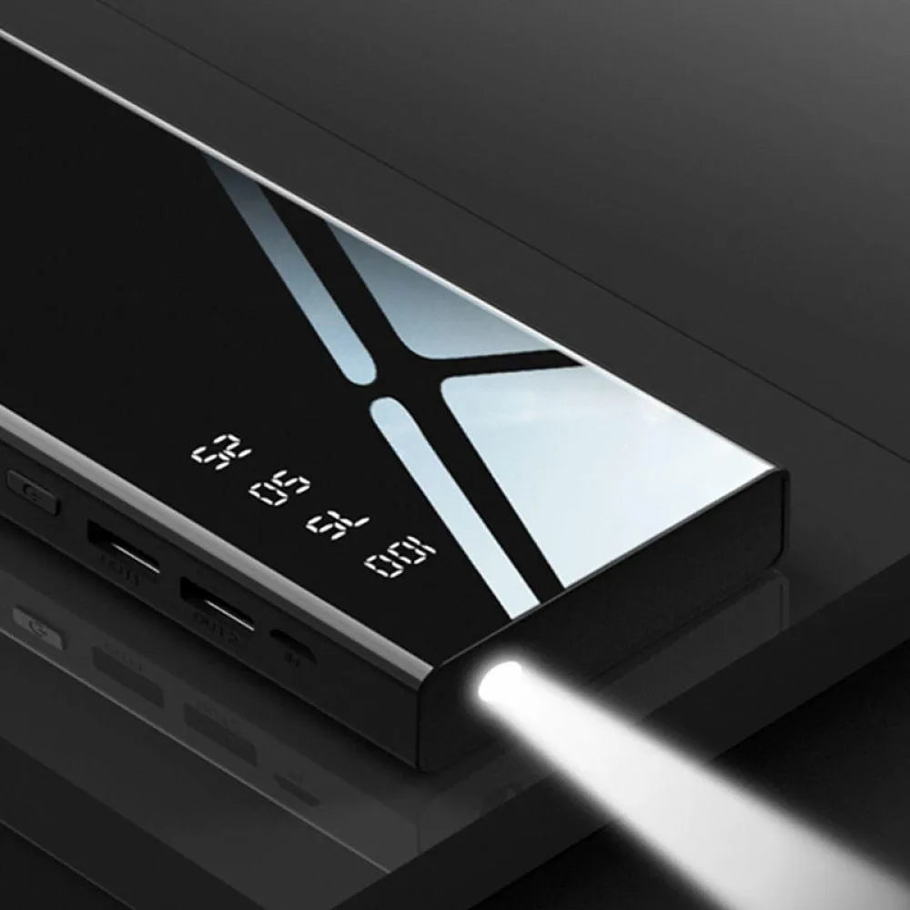 Black 20000mAh portable power bank with LCD screen and dual USB ports on a white background.