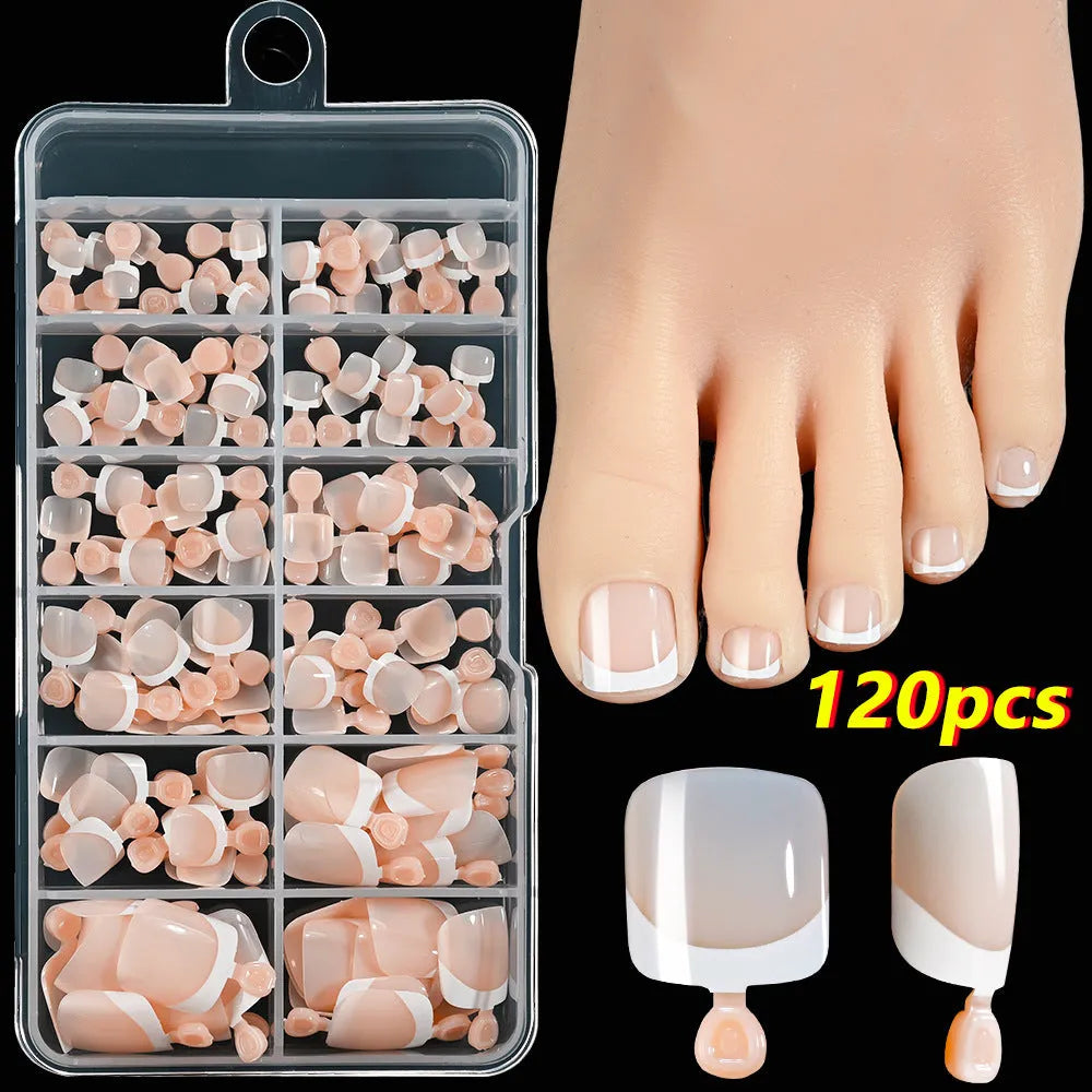 Box of 120 French white edge nude full square short artificial nail pieces showing nine colour shades