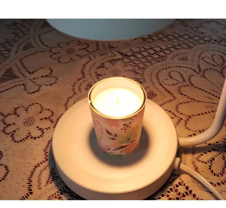 White European-style metal aromatherapy wax melt lamp with a dimmer switch on a table.