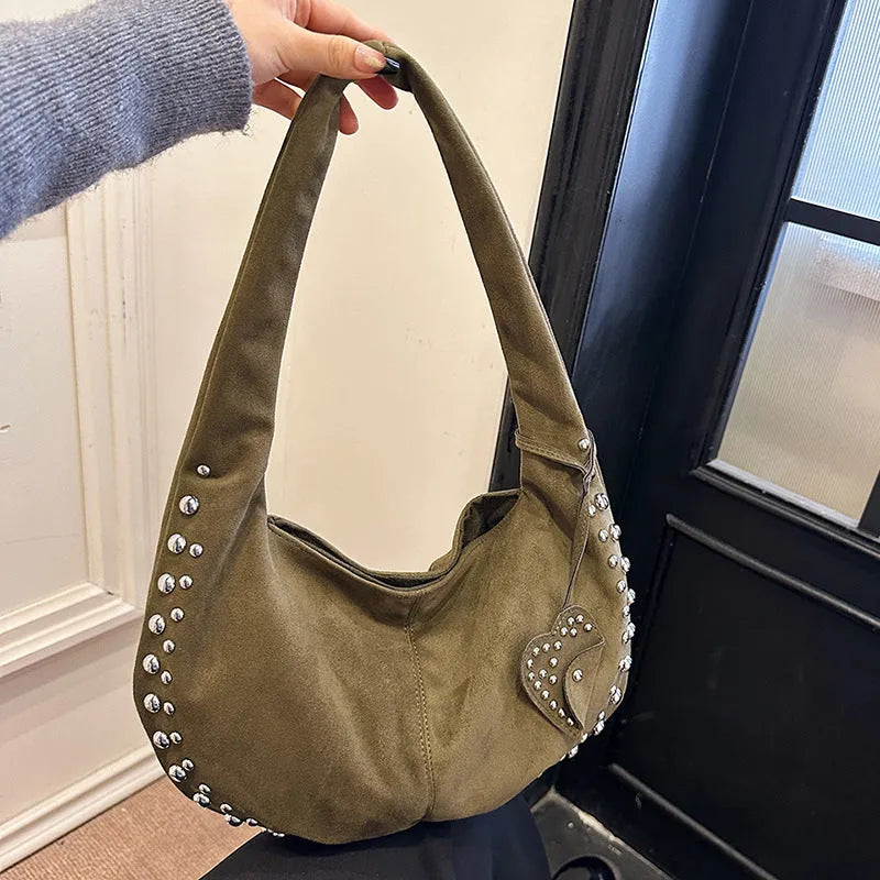 A soft plush retro style tote handbag for women in a strapless design, shown in a choice of colours.