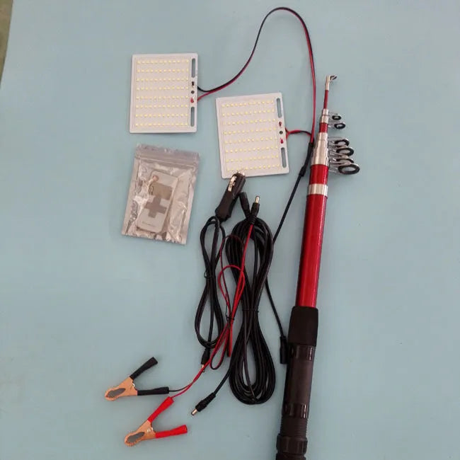 White LED fishing rod light unit with remote control next to extended telescopic pole