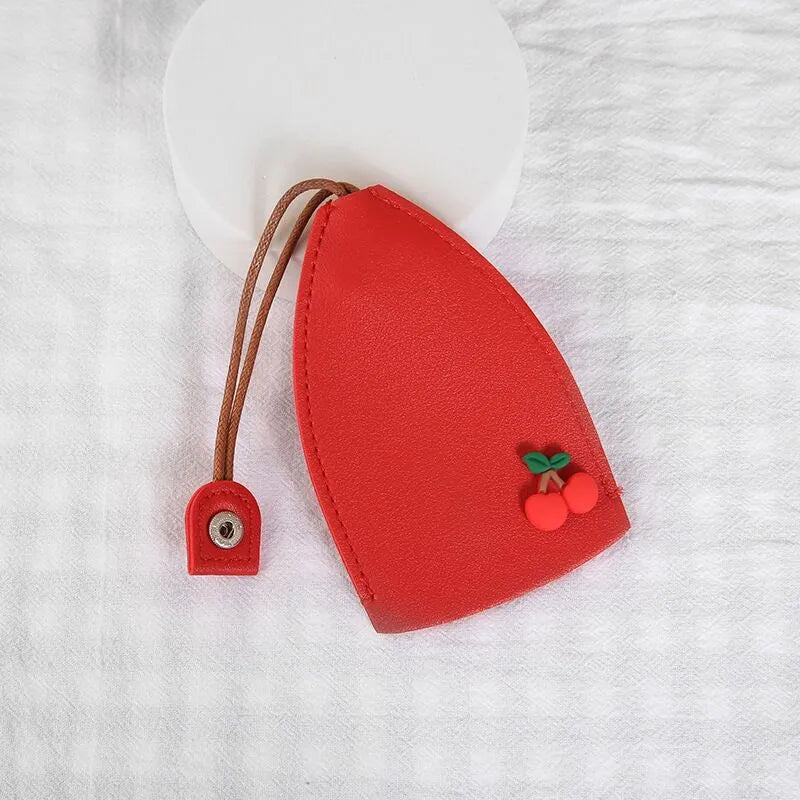 Colourful cartoon pull-out key case made from PU leather, showing the key extended from its protective sleeve.