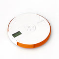 Blue 7-compartment alarm clock pill dispenser showing time display and medication slots