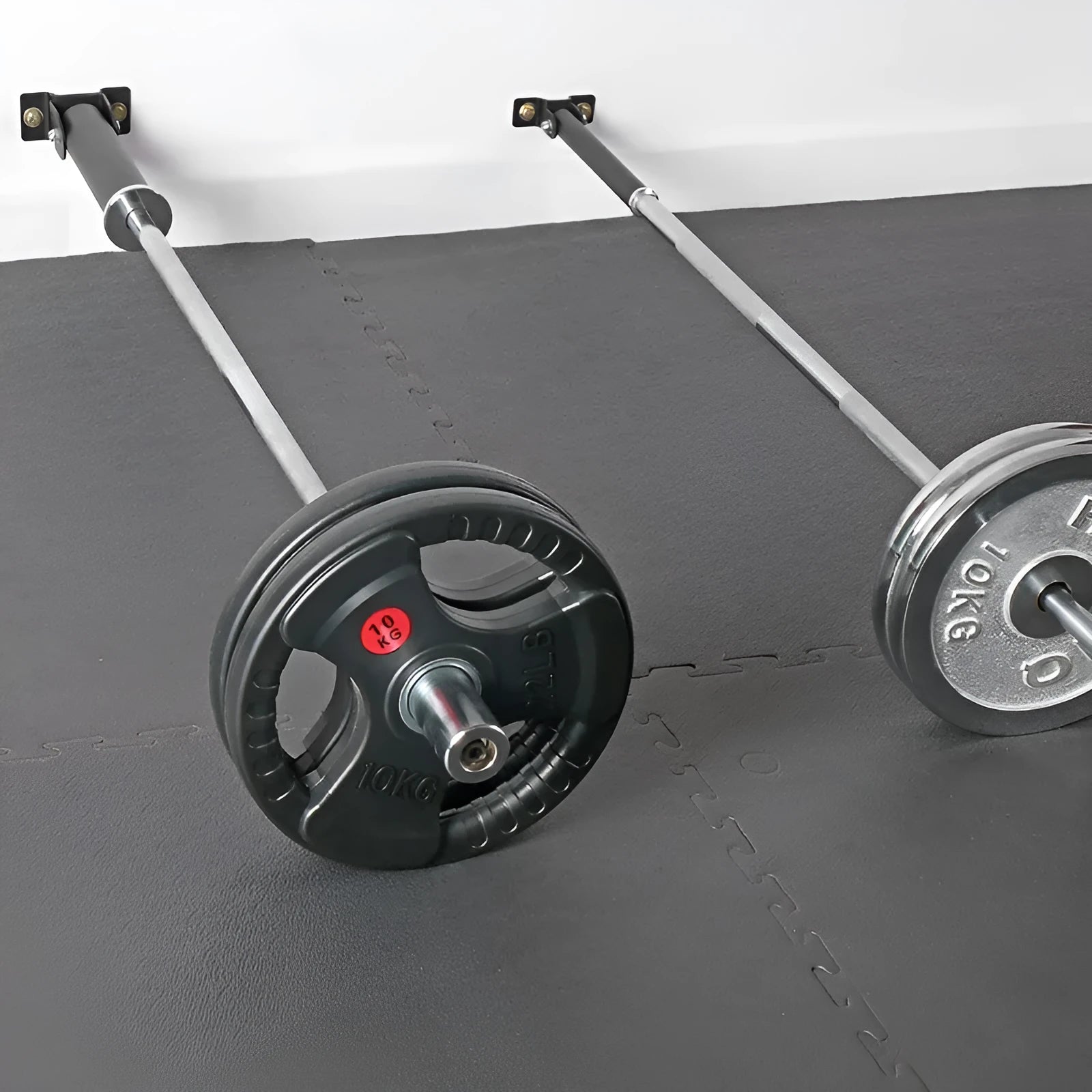 Steel wall-mounted rack holding multiple vertical barbell rods on a garage wall.