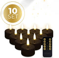 Set of four black S10 model LED flameless tealight candles showing size.