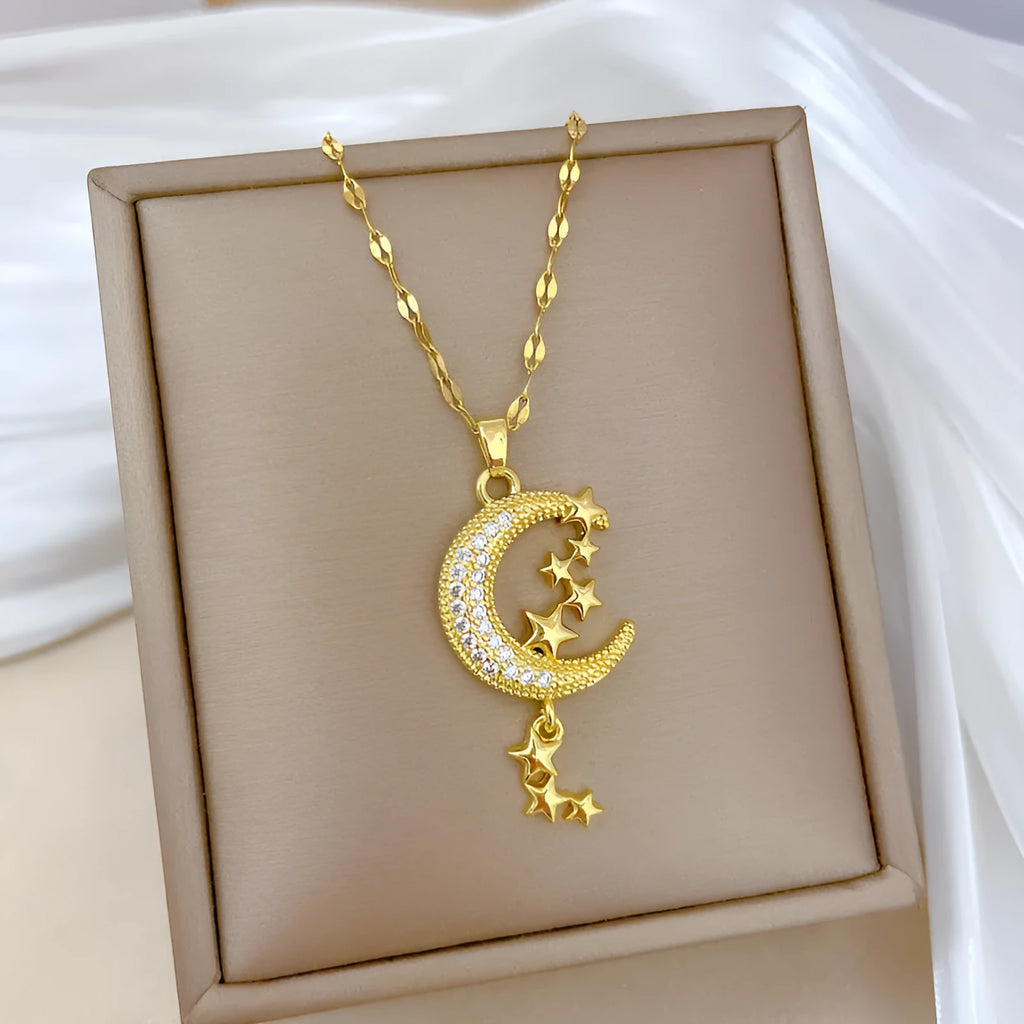 Geometric moon pendant necklace with diamond accents and tassel on stainless steel chain