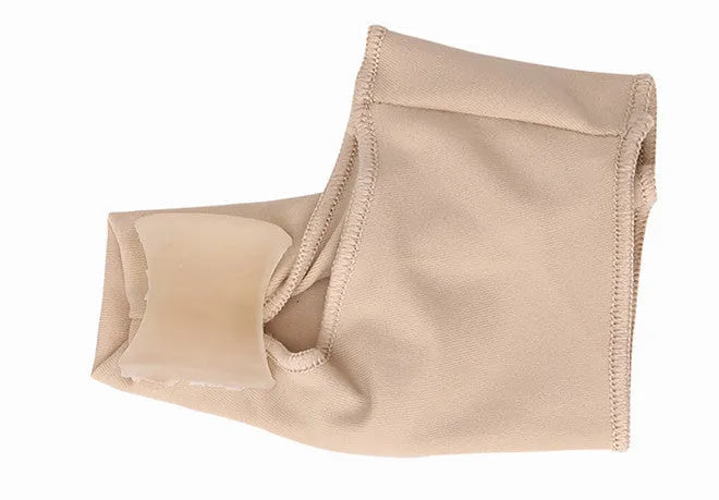 Corrective bunion relief sock with gel pad and silicone toe separator on a foot.