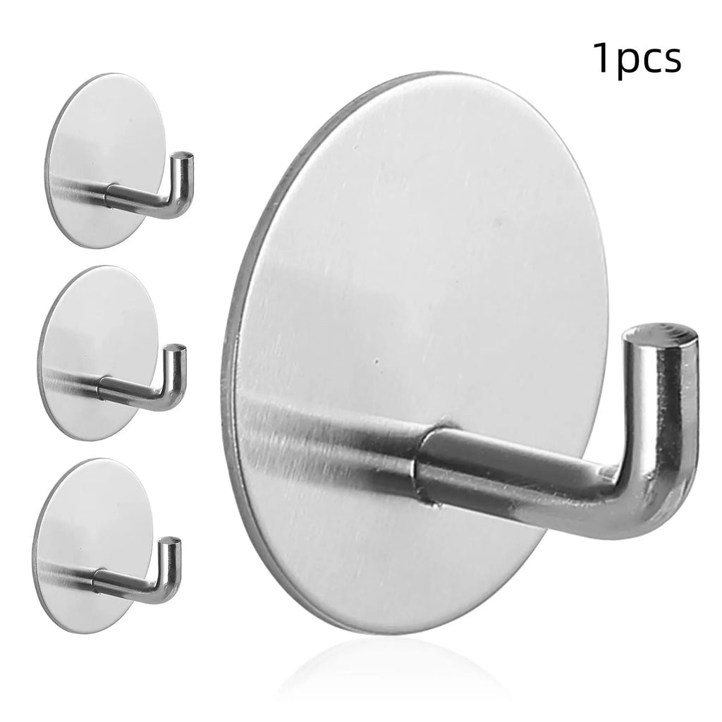 Round stainless steel self-adhesive hook in black and polished finishes for wall mounting.
