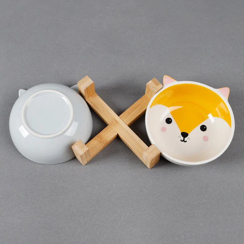 Raised ceramic cat food bowl in bamboo and wooden bracket, 13cm pottery dish, pink-eared fox design