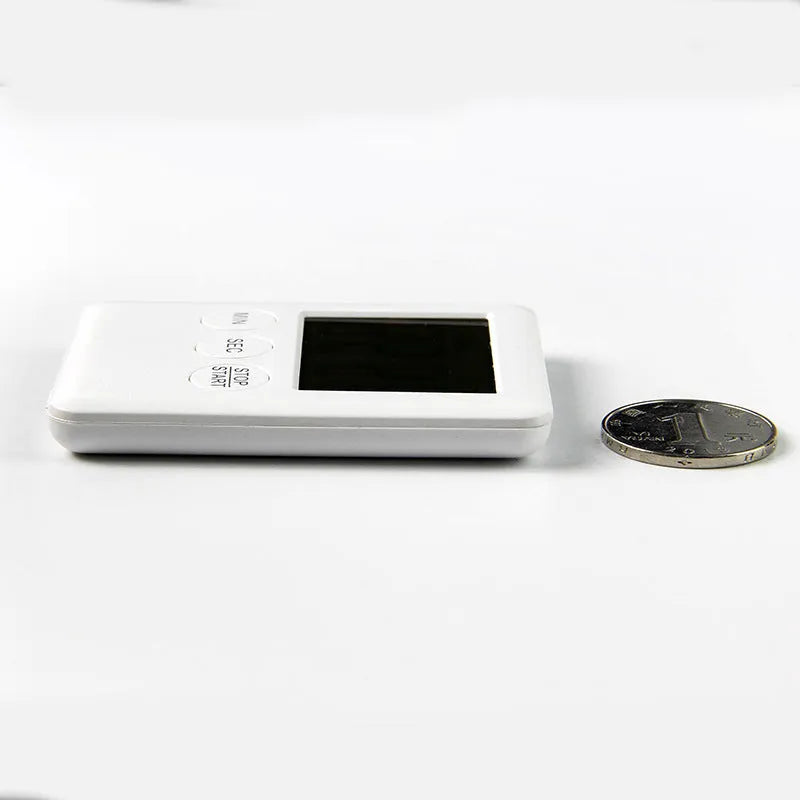 Black and white kitchen timer with magnetic back showing countdown and count up functions