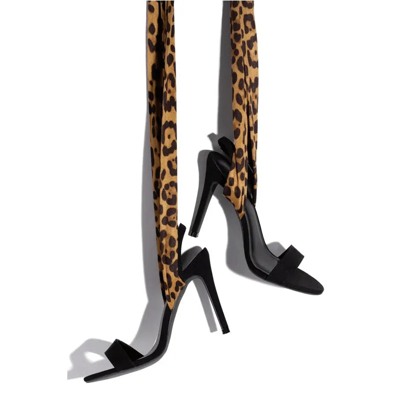 Light brown leopard print high heel shoes with cross strap design and stiletto heel