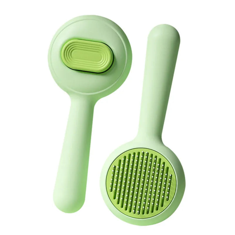 Green and yellow cat grooming brush with removable stainless steel comb and non-slip handle