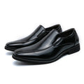 Men's black pointed patent leather casual shoes with a flat rubber sole and totem detail