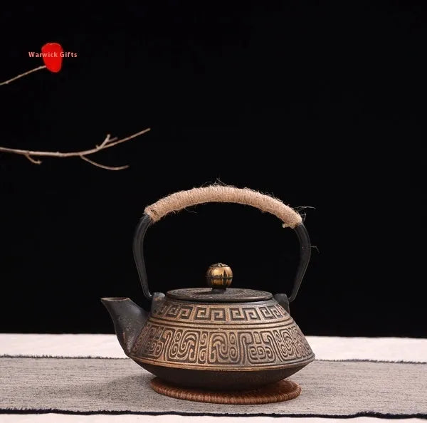 Cast iron teapot with Japanese decorative pattern and enamel interior, 0.9 litre capacity