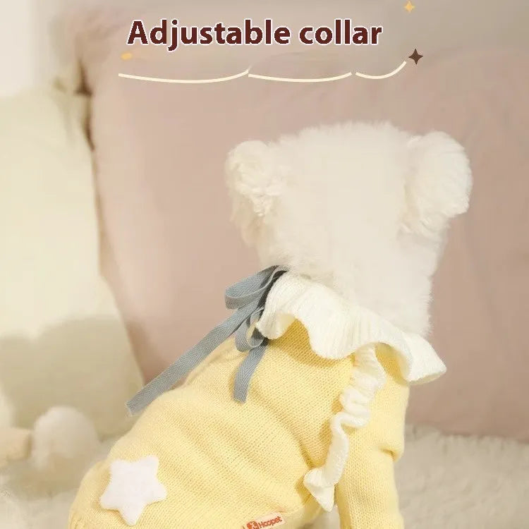 Yellow acrylic puppy sweater for small dog on size guide showing XS S M L XL chest measurements.