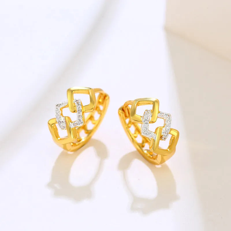 Gold geometric hollow-out alloy earrings with ear clip fastening and colour separation electroplating