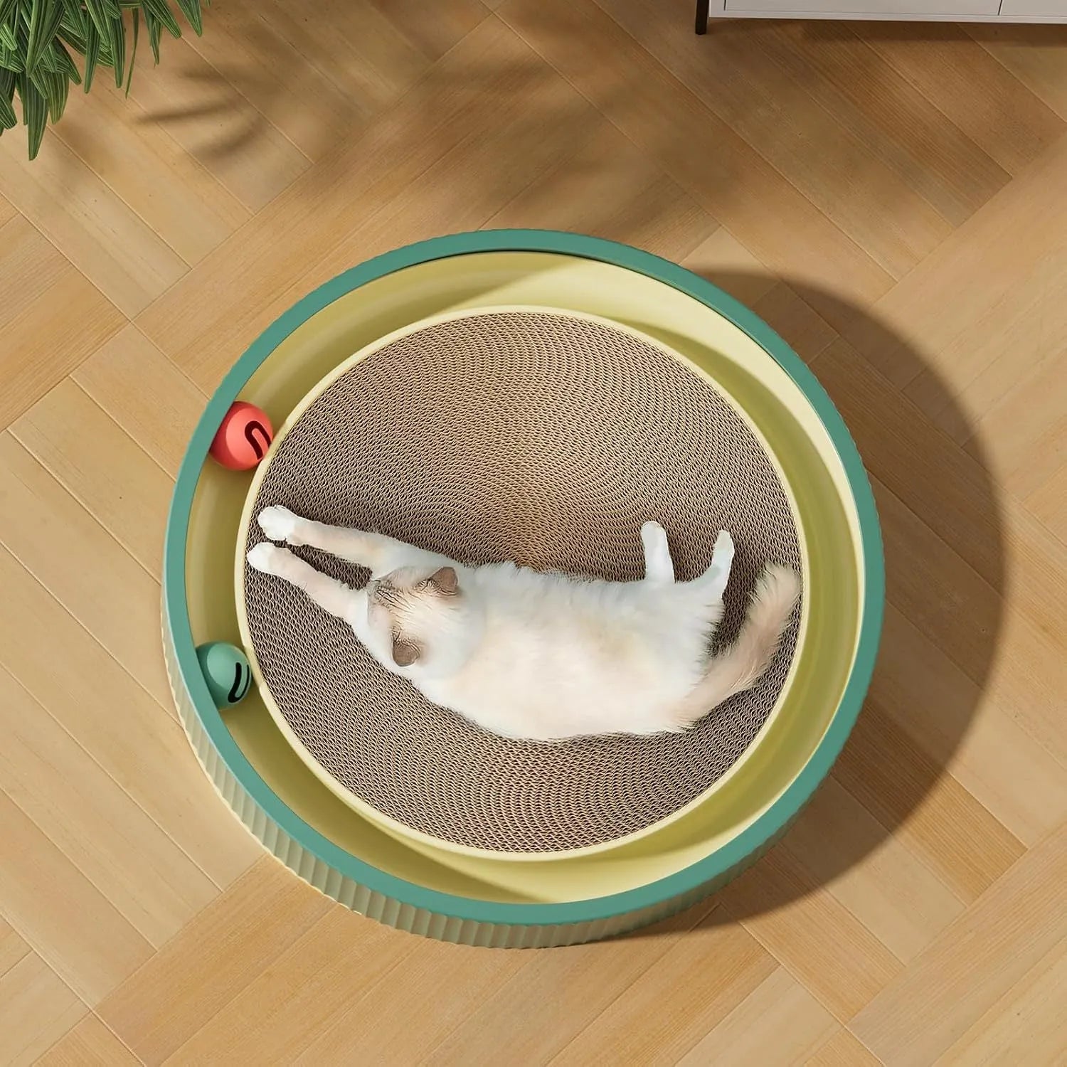 Large circular cardboard cat scratching board with integrated ball toys and replaceable core
