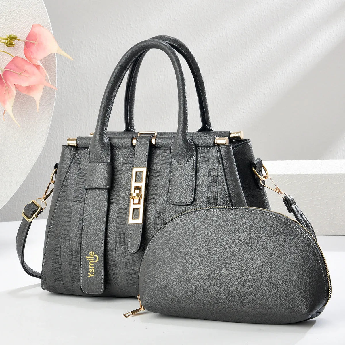 Round PU leather crossbody shoulder bag in black, shown with adjustable strap and measuring 28cm wide.