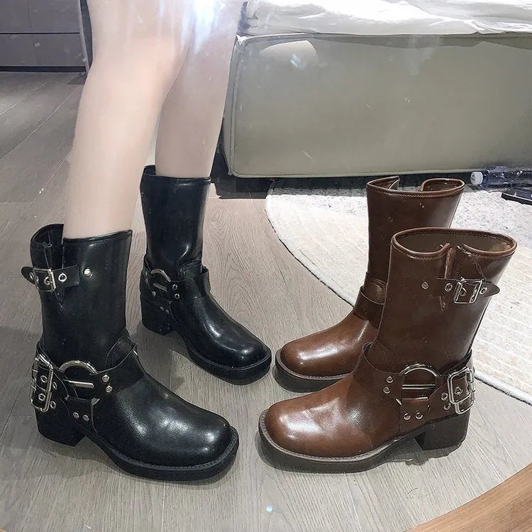 Women's black platform ankle boots with buckle detailing and mid-calf height