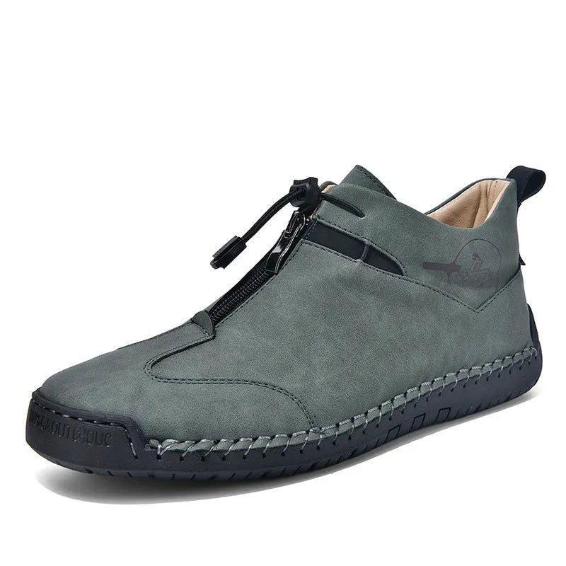 Men's black casual leather sneakers with a mid heel and round toe on a rubber sole.