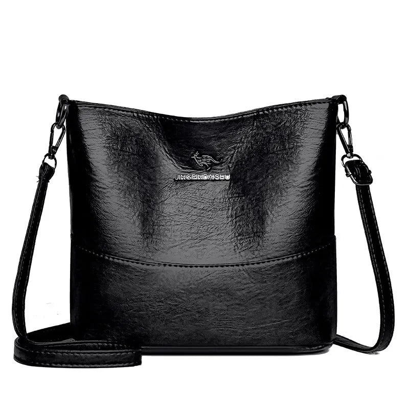 Women's soft leather large capacity bucket shoulder bag in minimalist luxury style with sewing line details.