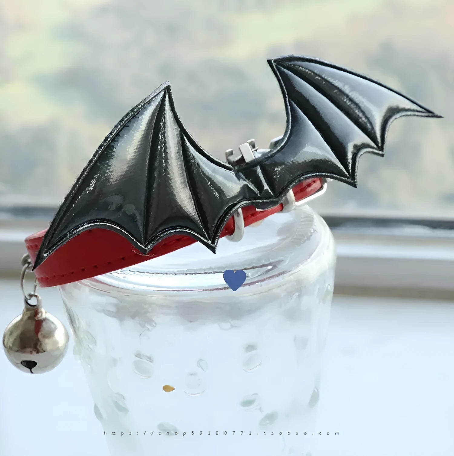 Black patent leather choker collar with devil wings design and bell attachment