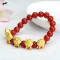 Red agate bracelet with Chinese dragon charm design showing 8mm beads