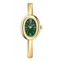 Women's gold and silver oval retro quartz watch with spiral pattern dial on wrist.