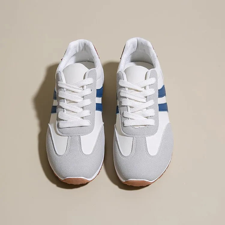 Blue and grey Cortez-style striped casual trainers with round toe and flat rubber sole.