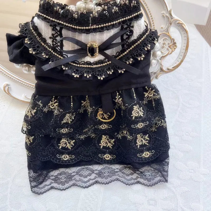 Golden gothic princess costume dress for a small dog or cat on a hanger.