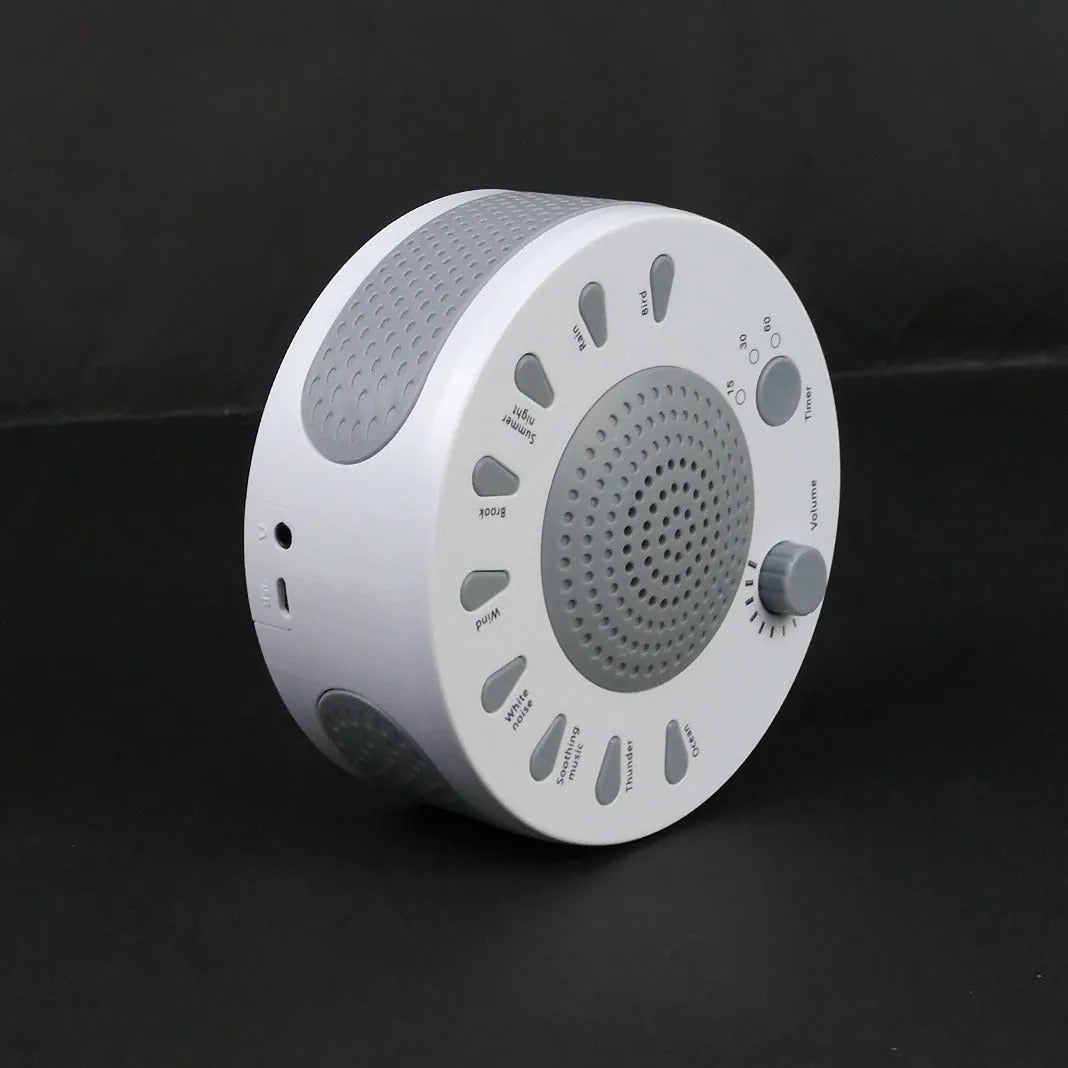 White noise sleep machine with volume knob and timer buttons showing compact portable design