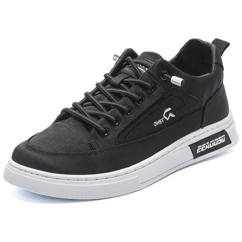 Grey men's low-top canvas casual shoes with a round toe and white rubber sole on a plain background.
