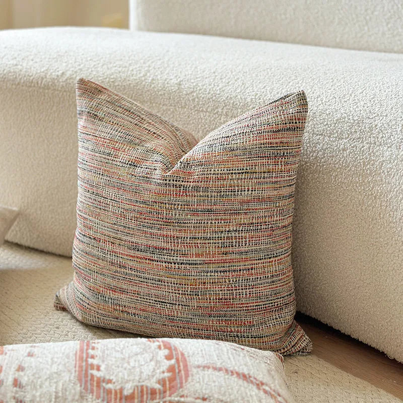 American-style jacquard paisley decorative pillow cover in amber tones on a sofa, showing square and rectangular size options.