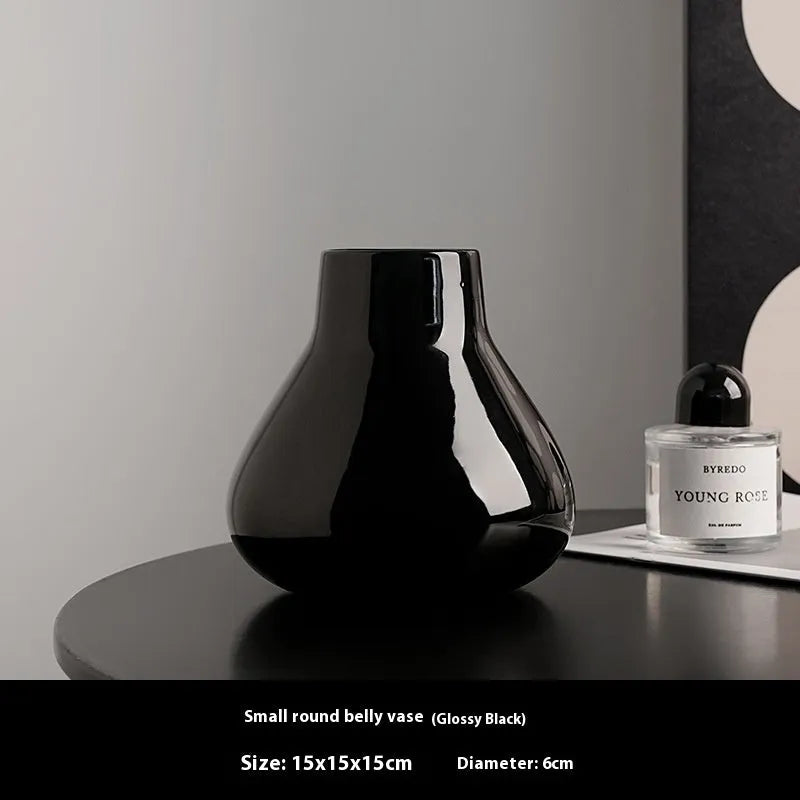 Ceramic decorative vase with glass surface in black or white colour with round belly French design