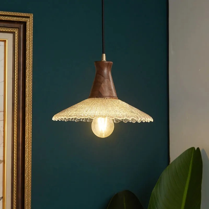 Retro style wooden and brass chandelier with glass shade ceiling lamp for restaurants.