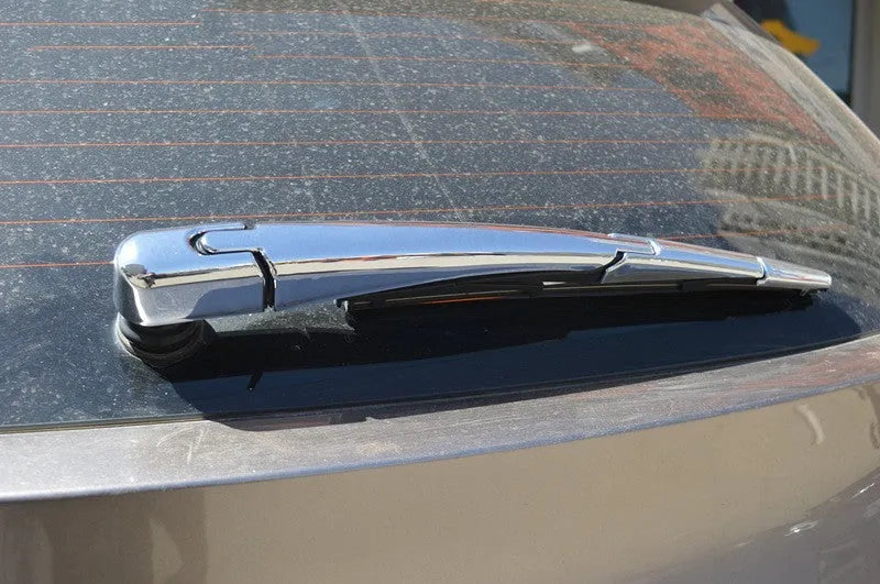 Set of four silvery ABS plastic rear window wiper cover trim strips for a 2010 Hyundai.