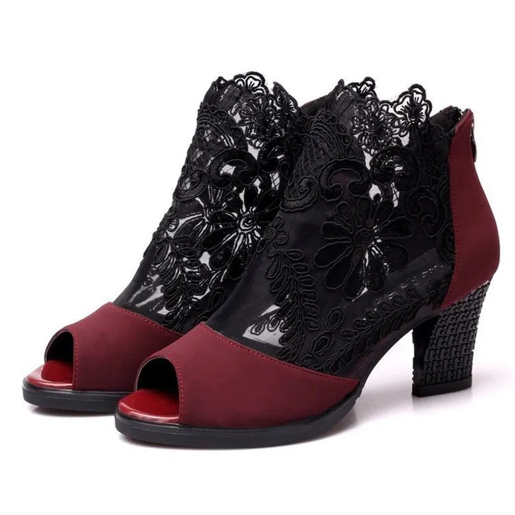 Black women's gladiator sandals with floral lace upper, square high heel, peep toe, and zip closure.
