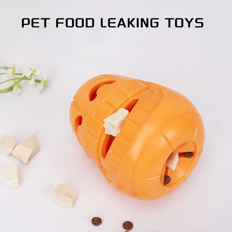 Orange Halloween pumpkin shaped interactive dog chew toy with treat-dispensing funnel.