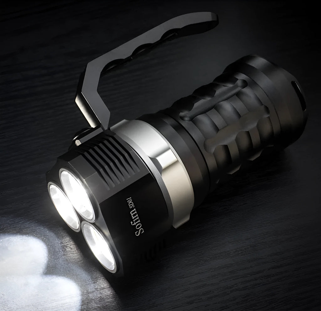 Aluminium alloy diving tube flashlight, 18cm long, shown in hand for scale.