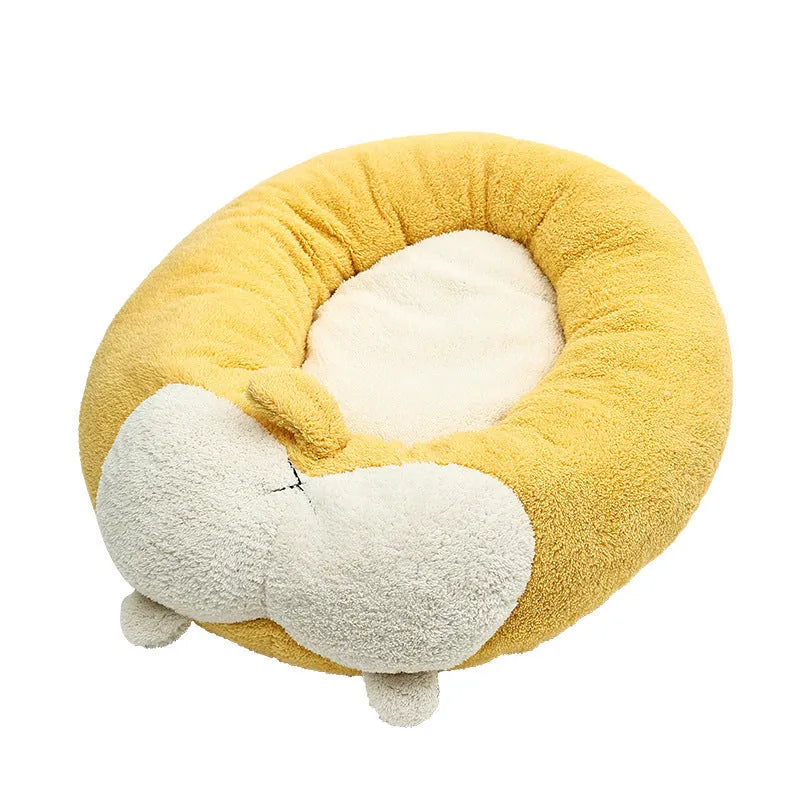Brown and white corgi-shaped plush pet bed for dogs or cats on a wooden floor.