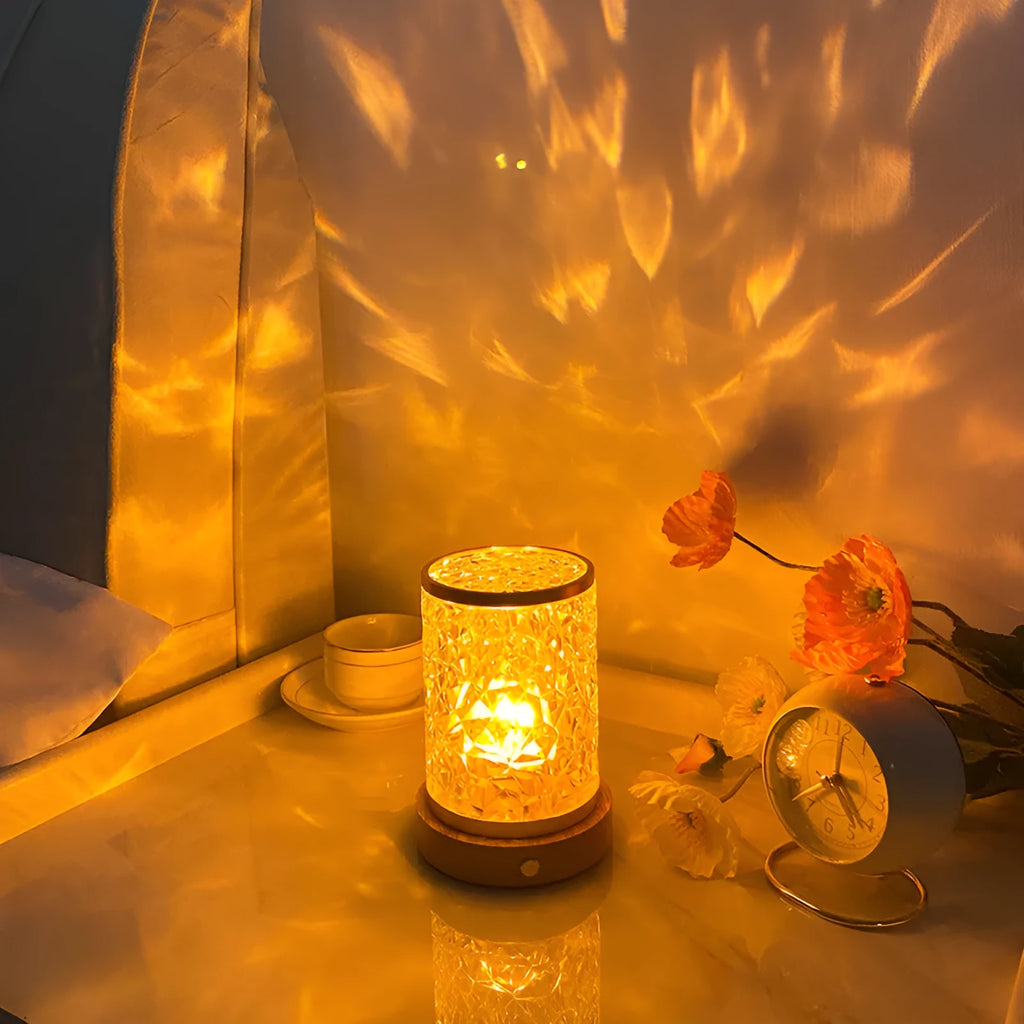 Rotating water ripple night light with acrylic body and solid wood base projecting colourful light patterns