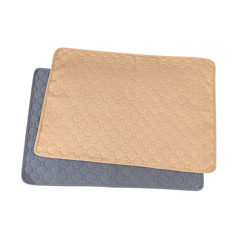 Washable tan and grey reusable dog pee pad on a wooden floor