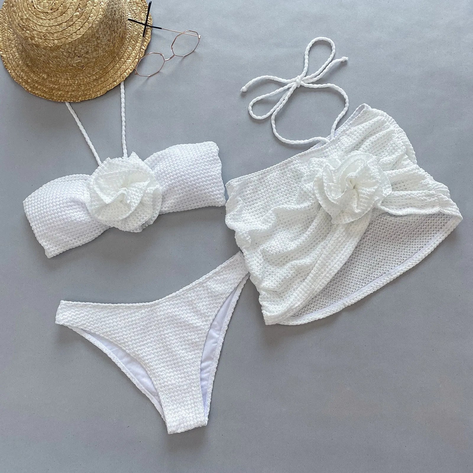 Women's purple and white 3D flower split three-piece bikini set with bra, briefs, and skirt.