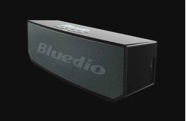 Black Bs-6 compact Bluetooth smart speaker showing front and side.