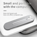 Silver aluminium laptop bracket holding a smartphone next to a laptop screen.